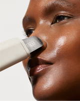 DERMAPORE+ SONIC SKINCARE SET - Stone | model using DERMAPORE+ from the DERMAPORE+ Sonic Skincare Set in Stone