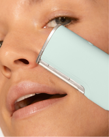 LUXE+ SONIC SKINCARE SET - Sea Foam | model using LUXE+ from the LUXE+ Sonic Skincare Set in Sea Foam