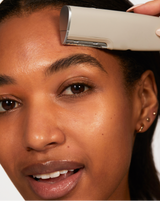 LUXE+ SONIC SKINCARE SET - Stone | model using LUXE+ from the LUXE+ Sonic Skincare Set in Stone