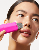 COMPLETE SONIC SKINCARE SET - Pop Pink | model using DERMAPORE+ from the Complete Sonic Skincare Set in Pop Pink