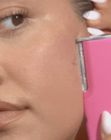 DERMAFLASH LUXE+ - Blush | Model demonstrating how to glide LUXE+ over your face in short, feathery strokes