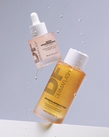 DERMAPORE+ SONIC SKINCARE SET - BOTANICAL KETOACID TONER and ACTIVE COCOONING SERUM shown on gray background from the DERMAPORE+ Sonic Skincare Set in Peach Fuzz