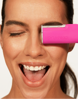 DERMAFLASH LUXE+ - Pop Pink | Model holding LUXE+ in Pop Pink near her face